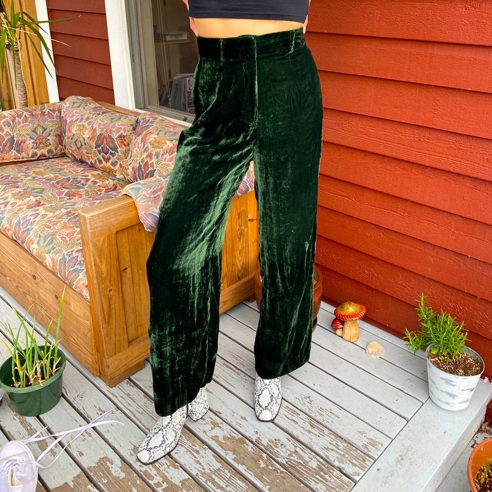 ASOS brand green velvet high-waisted flare pants.